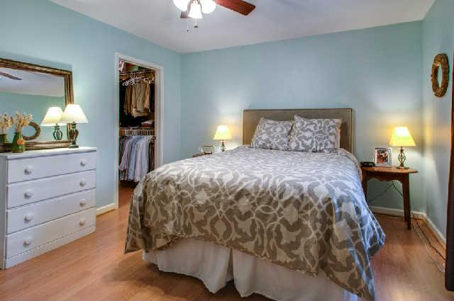 420 Elysian Fields Road, Unit E10 Nashville, TN 37211 - Photo 13 of 20 a bedroom with a bed and a lamp on dresser