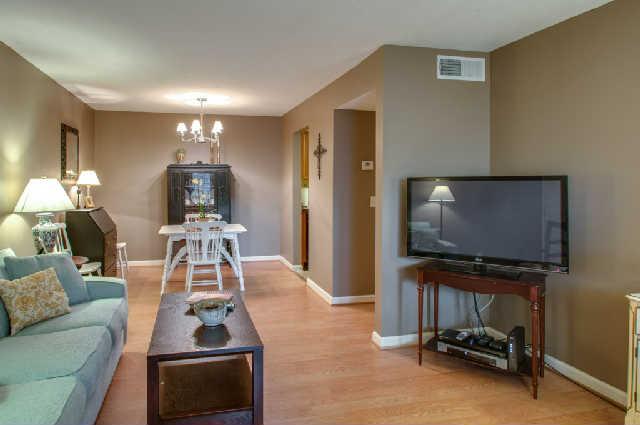 420 Elysian Fields Road, Unit E10 Nashville, TN 37211 - Photo 3 of 20 a living room with furniture and a flat screen tv