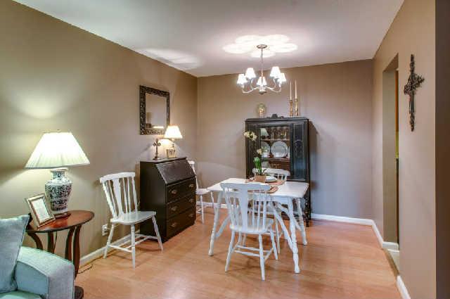 420 Elysian Fields Road, Unit E10 Nashville, TN 37211 - Photo 5 of 20 a view of a dining room with furniture and chandelier