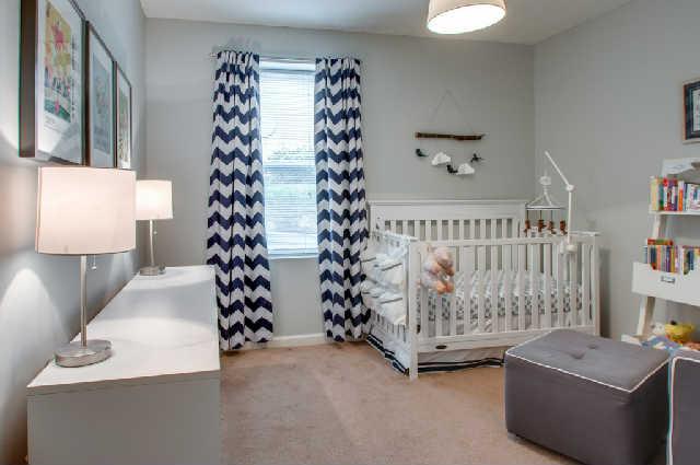 420 Elysian Fields Road, Unit E10 Nashville, TN 37211 - Photo 10 of 20 a bedroom with furniture and a window