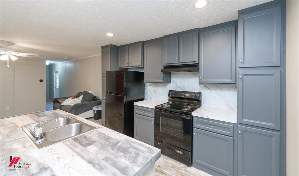 2470 Highway 792 Heflin, LA 71039 - Photo 12 of 25 a kitchen with a sink appliances and cabinets