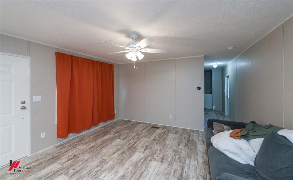 2470 Highway 792 Heflin, LA 71039 - Photo 14 of 25 a bedroom with a bed and a chandelier