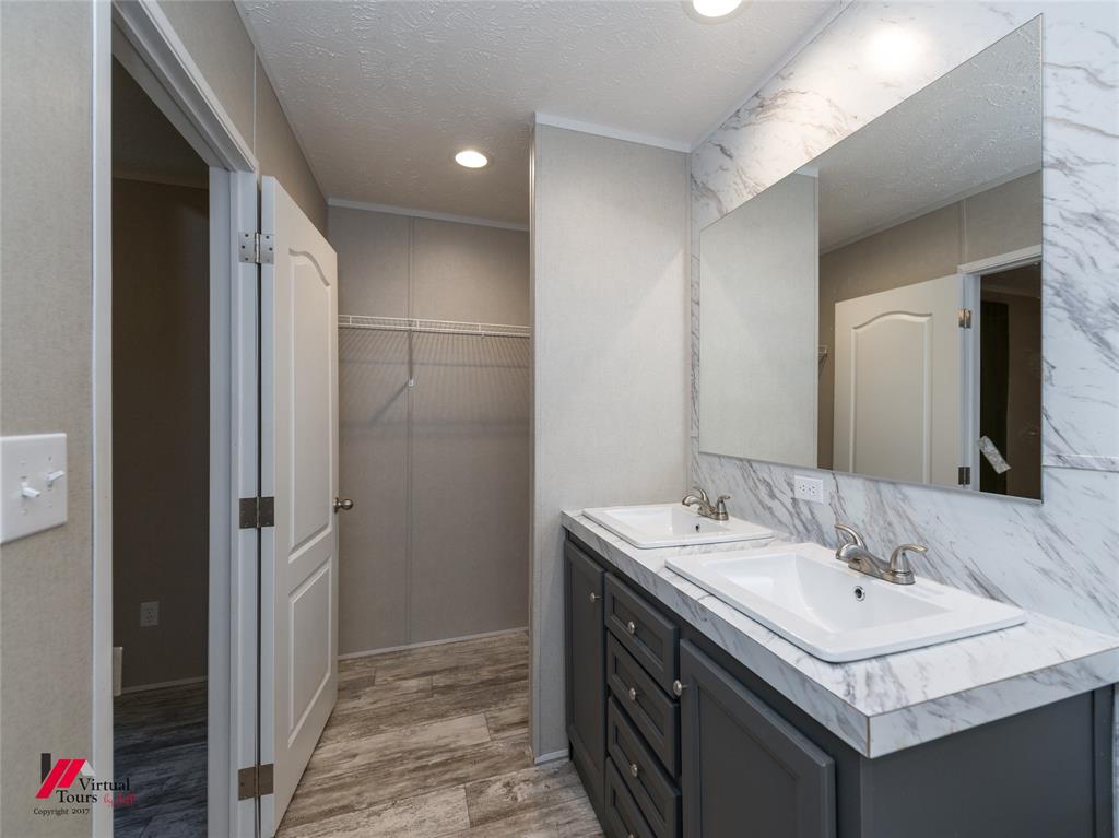 2470 Highway 792 Heflin, LA 71039 - Photo 15 of 25 a bathroom with a sink and a mirror