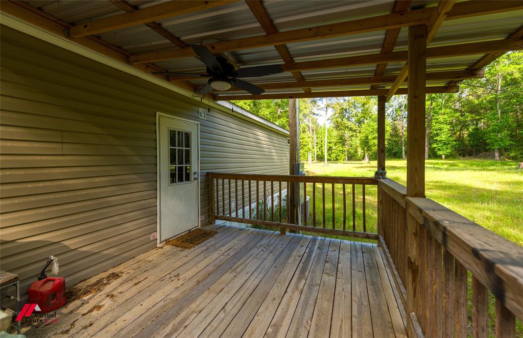 2470 Highway 792 Heflin, LA 71039 - Photo 23 of 25 a view of a balcony with wooden floor