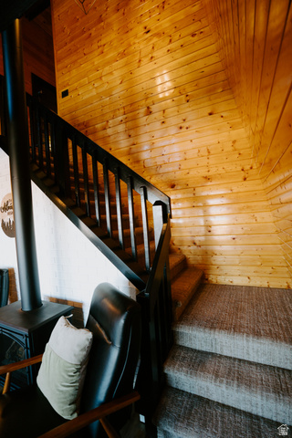 1413 Basel Drive Midway, UT 84049 - Photo 19 of 137 Stairs with a wood stove and wooden ceiling