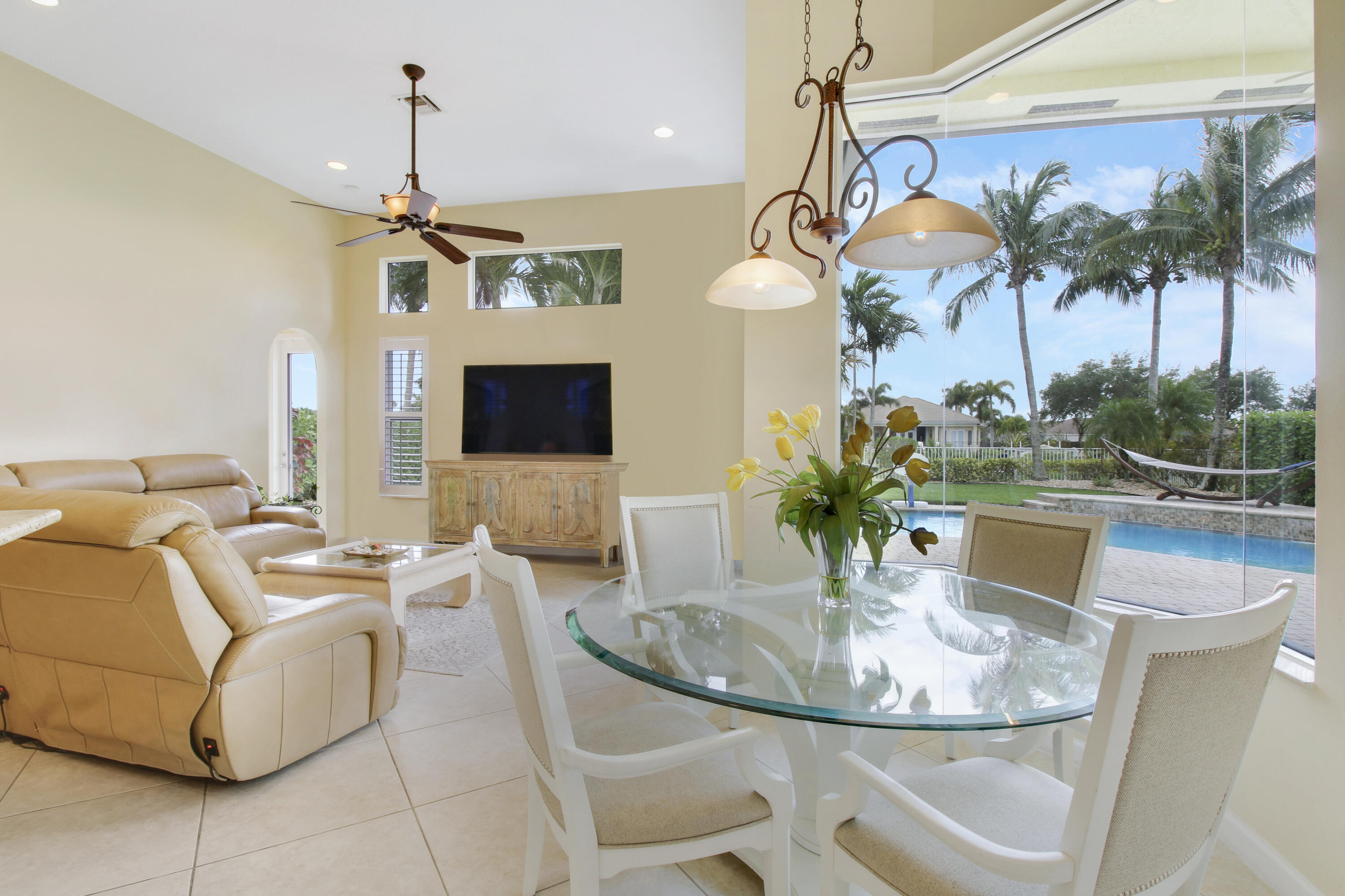 660 Southwest Yacht Basin Way Stuart, FL 34997 - Photo 11 of 42 a dining room with furniture and a floor to ceiling window