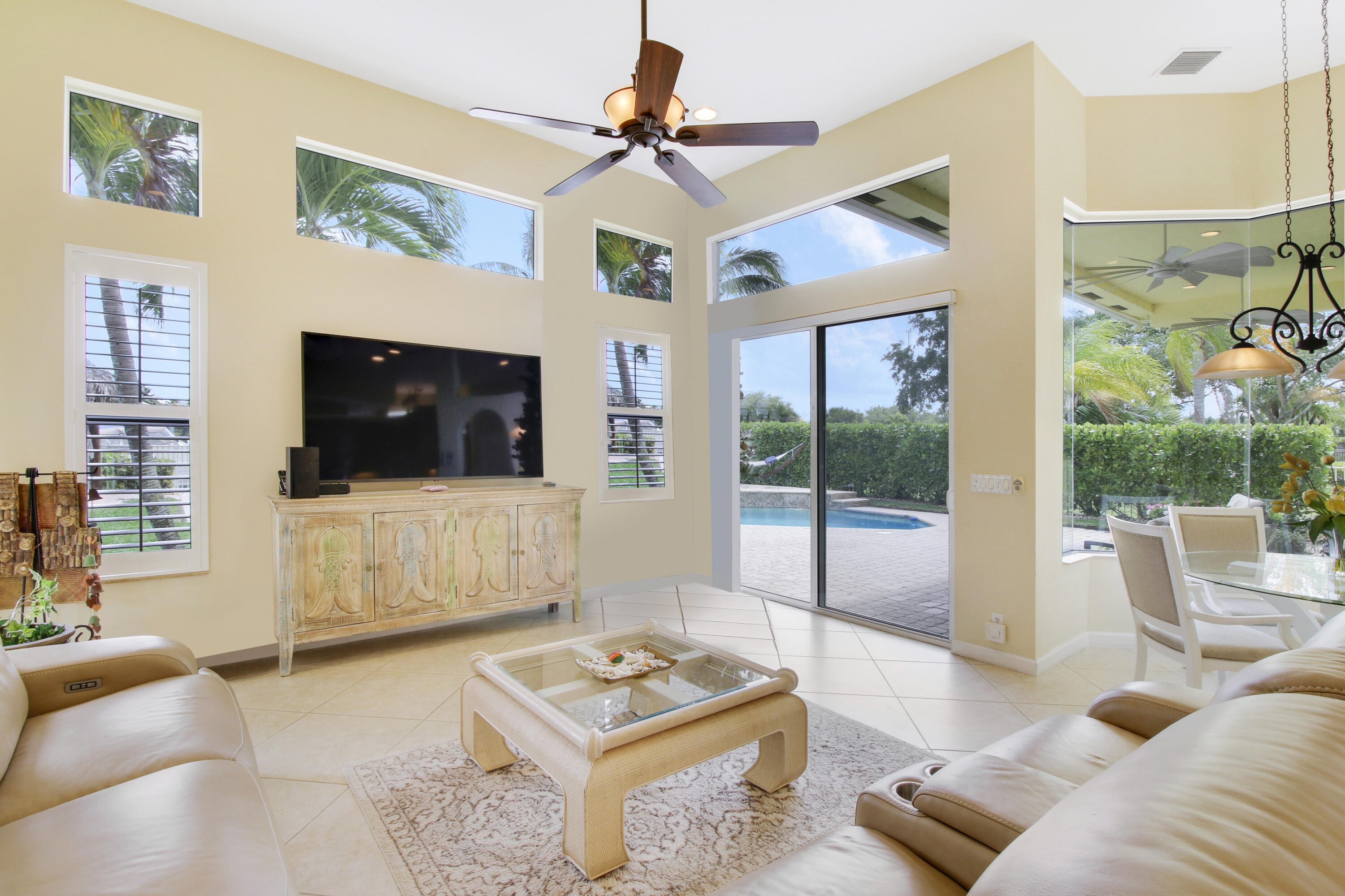 660 Southwest Yacht Basin Way Stuart, FL 34997 - Photo 12 of 42 a living room with furniture and a flat screen tv