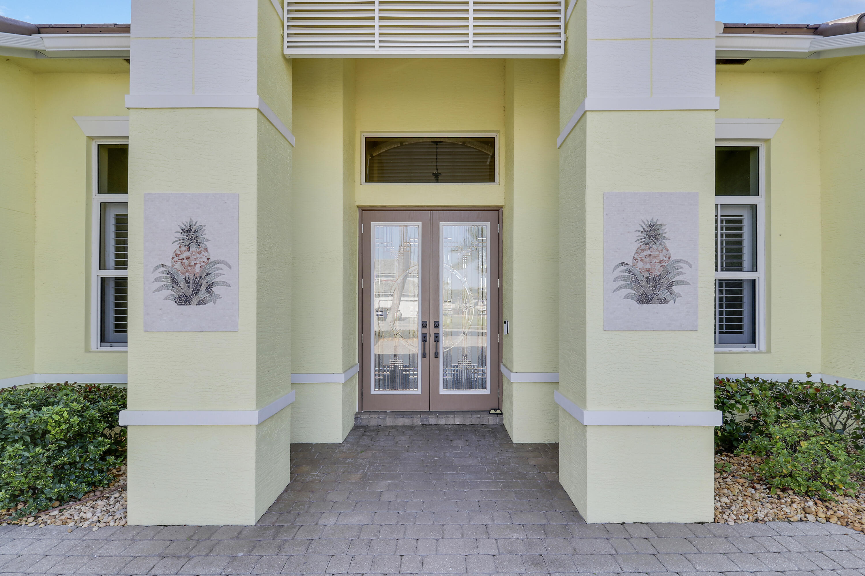 660 Southwest Yacht Basin Way Stuart, FL 34997 - Photo 4 of 42 a front view of a house with a door