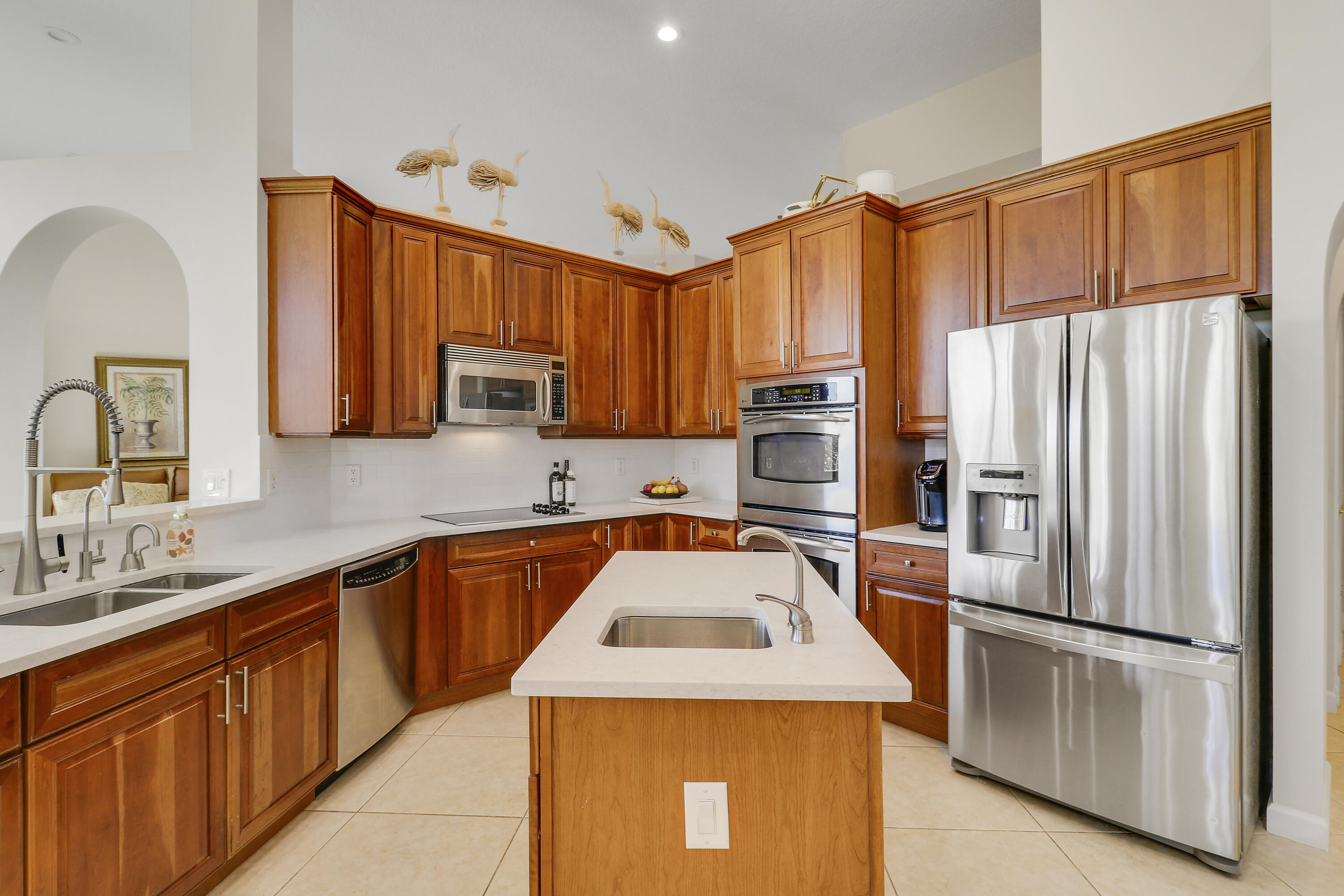 660 Southwest Yacht Basin Way Stuart, FL 34997 - Photo 7 of 42 a kitchen with stainless steel appliances granite countertop a refrigerator sink and microwave