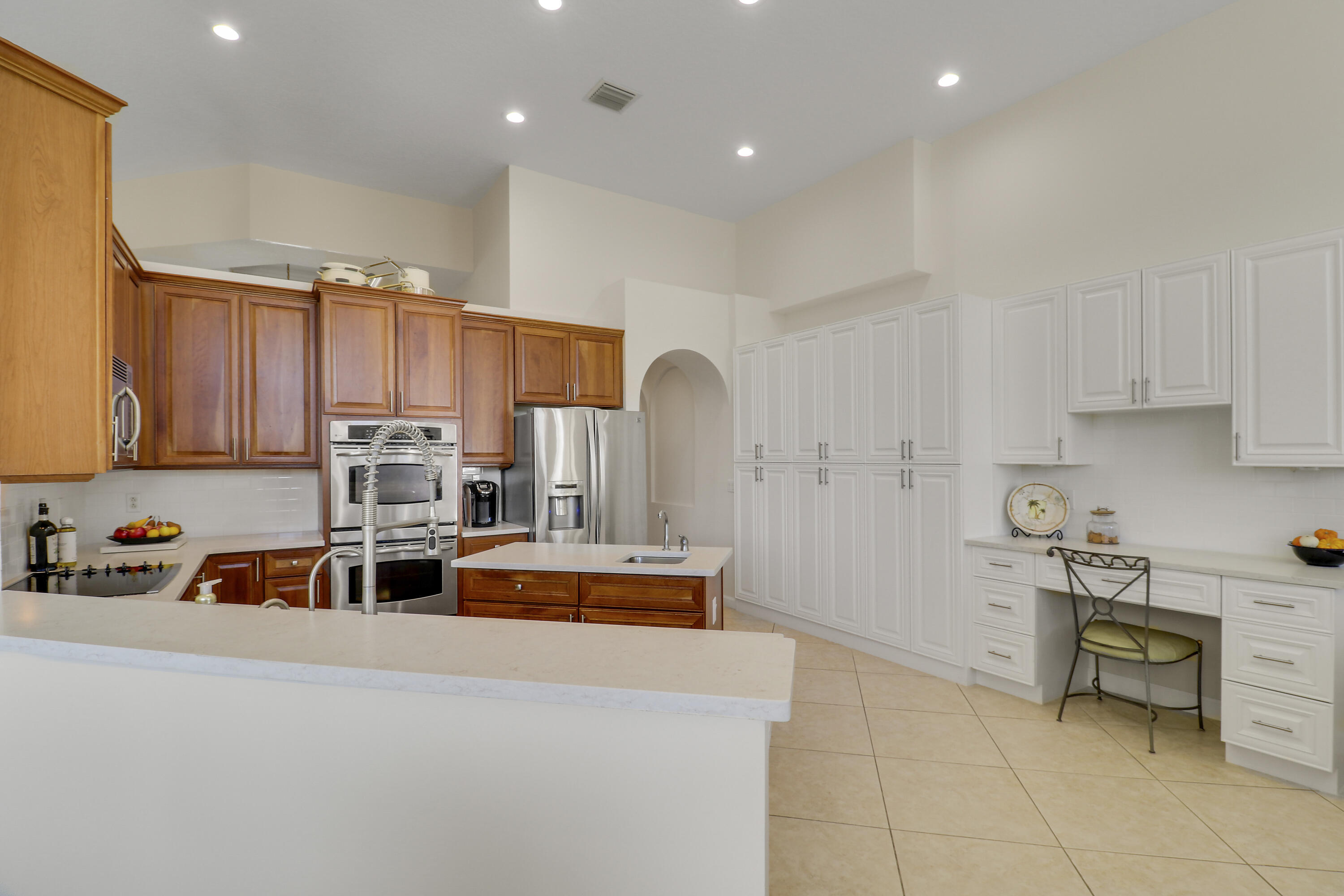 660 Southwest Yacht Basin Way Stuart, FL 34997 - Photo 10 of 42 a kitchen with stainless steel appliances a stove a sink a microwave and cabinets