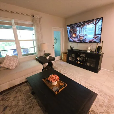 a living room with furniture window and a table