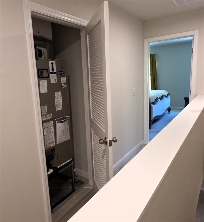 3087 Victoria Inlet Drive Holiday, FL 34691 - Photo 20 of 46 a view of a hallway with wooden floor and closet