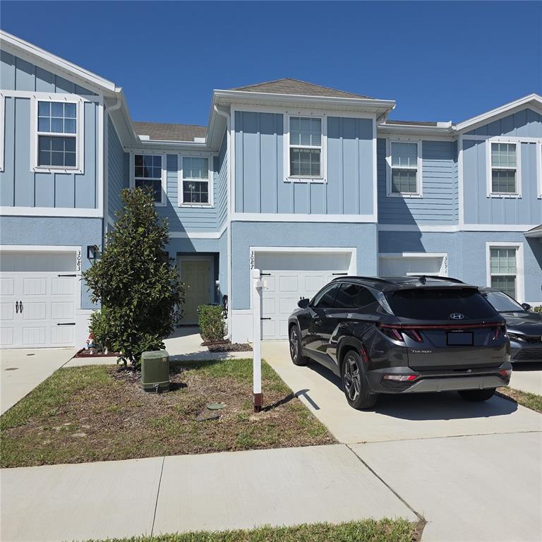 3087 Victoria Inlet Drive Holiday, FL 34691 - Photo 2 of 46 a car parked in front of a house