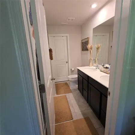 a bed room with a bed and a mirror