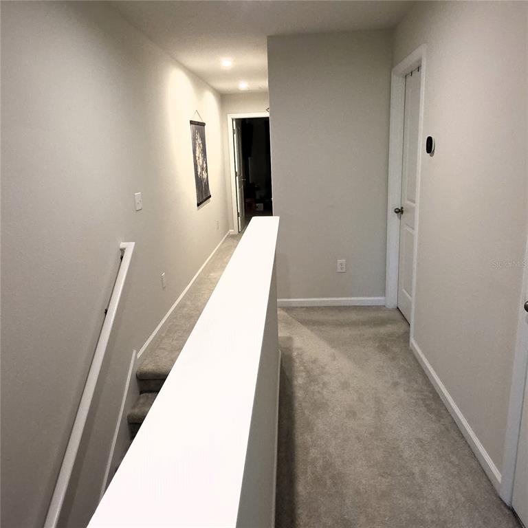 3087 Victoria Inlet Drive Holiday, FL 34691 - Photo 29 of 46 a view of hallway with stairs