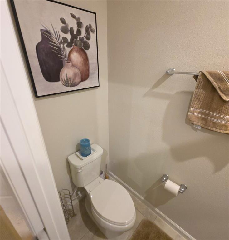 3087 Victoria Inlet Drive Holiday, FL 34691 - Photo 31 of 46 a white toilet sitting next to a small bathroom