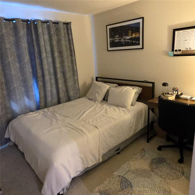 3087 Victoria Inlet Drive Holiday, FL 34691 - Photo 32 of 46 a large bed sitting in a bedroom next to a window