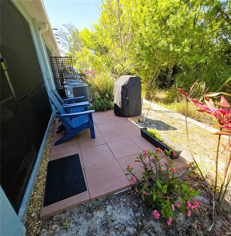 3087 Victoria Inlet Drive Holiday, FL 34691 - Photo 41 of 46 a garden view with a seating space