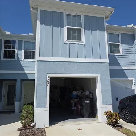 a front view of a house with a garage