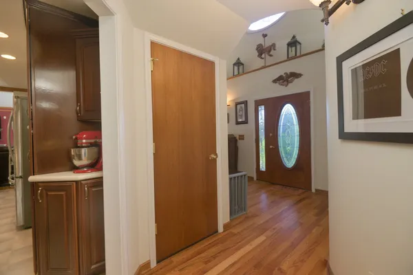 a front view of a house with plants