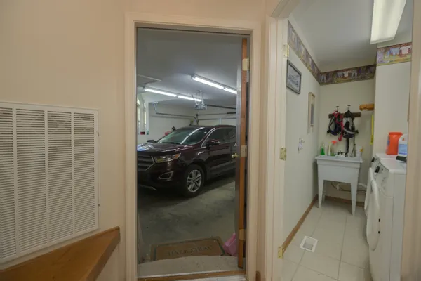 a view of a door and brick wall