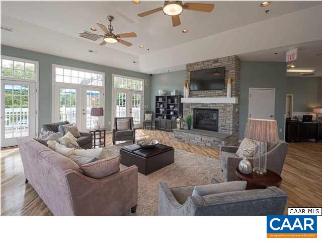 200 Lake Club Court, Unit 3 Charlottesville, VA 22902 - Photo 2 of 16 a living room with furniture fireplace and a large window