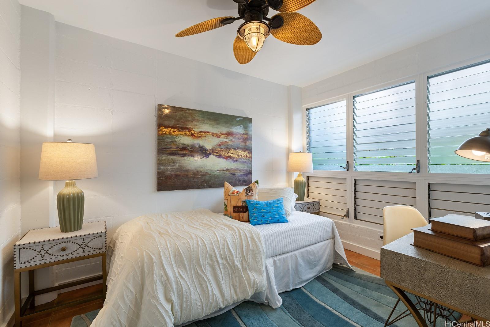 2957 Kalakaua Avenue, Unit 102 Honolulu, HI 96815 - Photo 11 of 15 a bedroom with bed and window