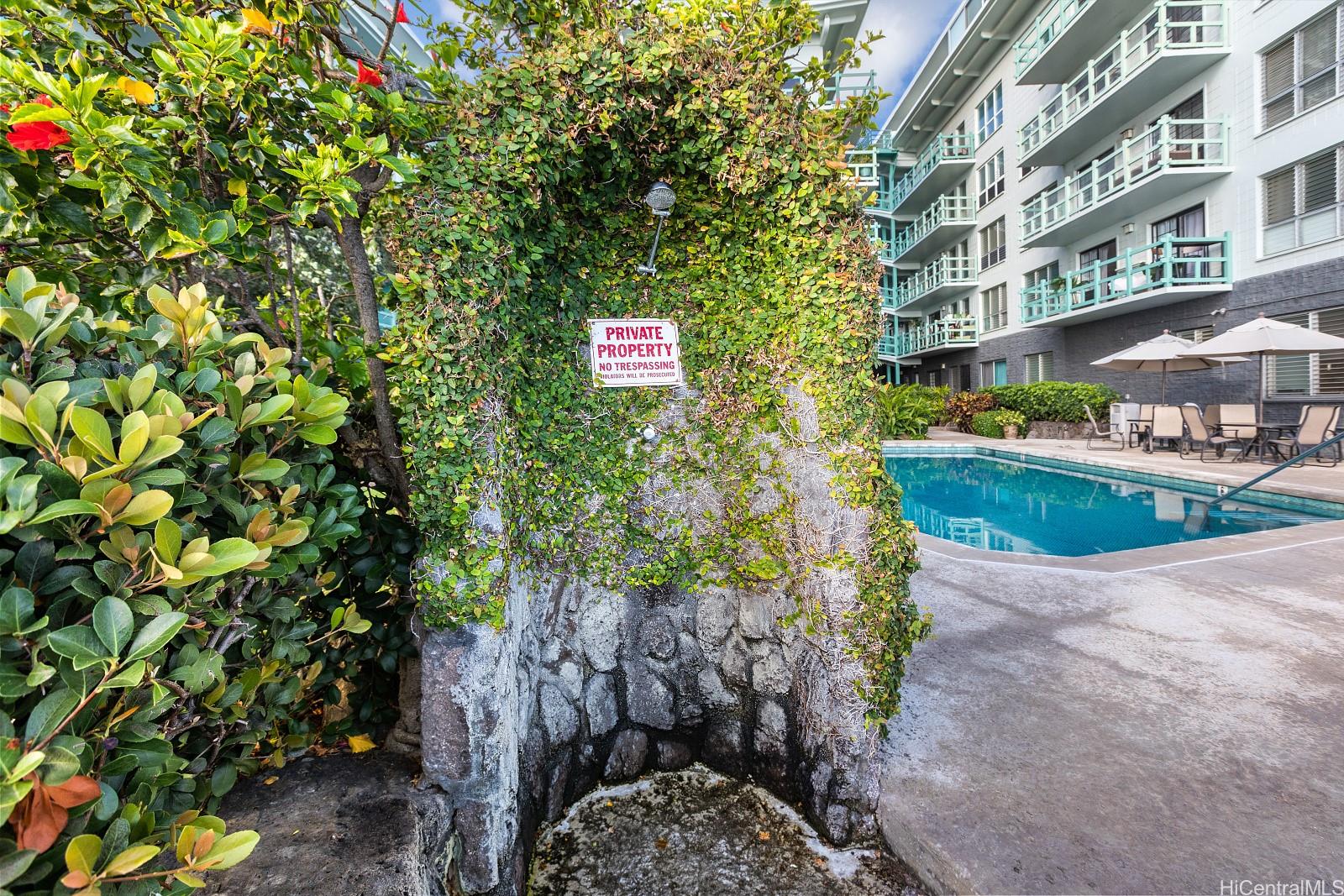 2957 Kalakaua Avenue, Unit 102 Honolulu, HI 96815 - Photo 2 of 15 a sign that is sitting in front of a building