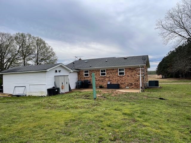240 Johns Road Toone, TN 38381 - Photo 12 of 22 a view of a house with a big yard and large tree
