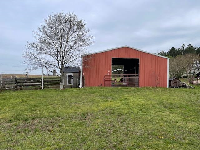 240 Johns Road Toone, TN 38381 - Photo 13 of 22 a backyard of a house with lots of green space
