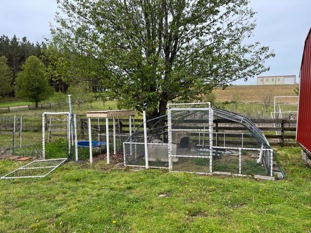 240 Johns Road Toone, TN 38381 - Photo 17 of 22 a view of an house with backyard space and balcony