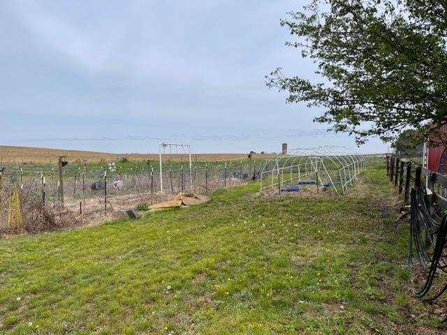 240 Johns Road Toone, TN 38381 - Photo 18 of 22 a view of a garden with a building in the background
