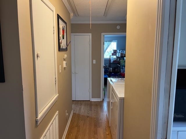 240 Johns Road Toone, TN 38381 - Photo 5 of 22 a view of a hallway with wooden floor and furniture