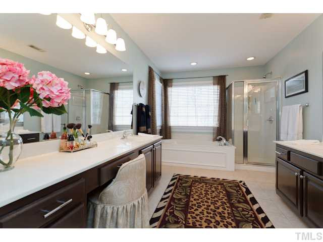 12508 Tappersfield Court Raleigh, NC 27613 - Photo 13 of 25 Beautiful Updates in the Master Bath! Separate Tub & Shower, Water Closet, & Tile Floors. Separate His/Her Sinks with Storage & Linen Closet. Master Bath/Spa