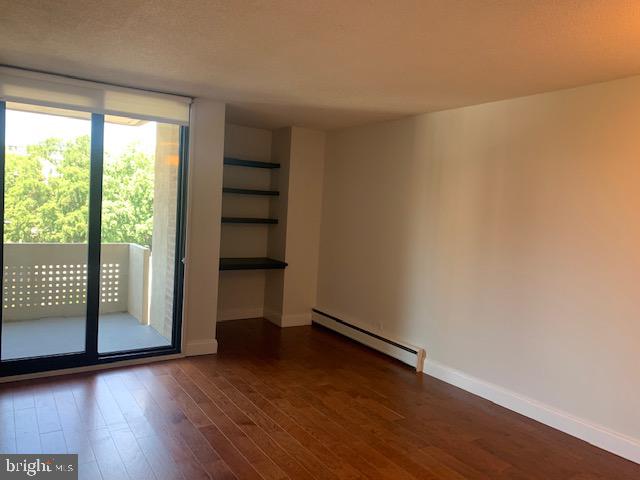 300 M Street Southwest, Unit N411 Washington, DC 20024 - Photo 3 of 13 a view of an empty room with wooden floor and a window
