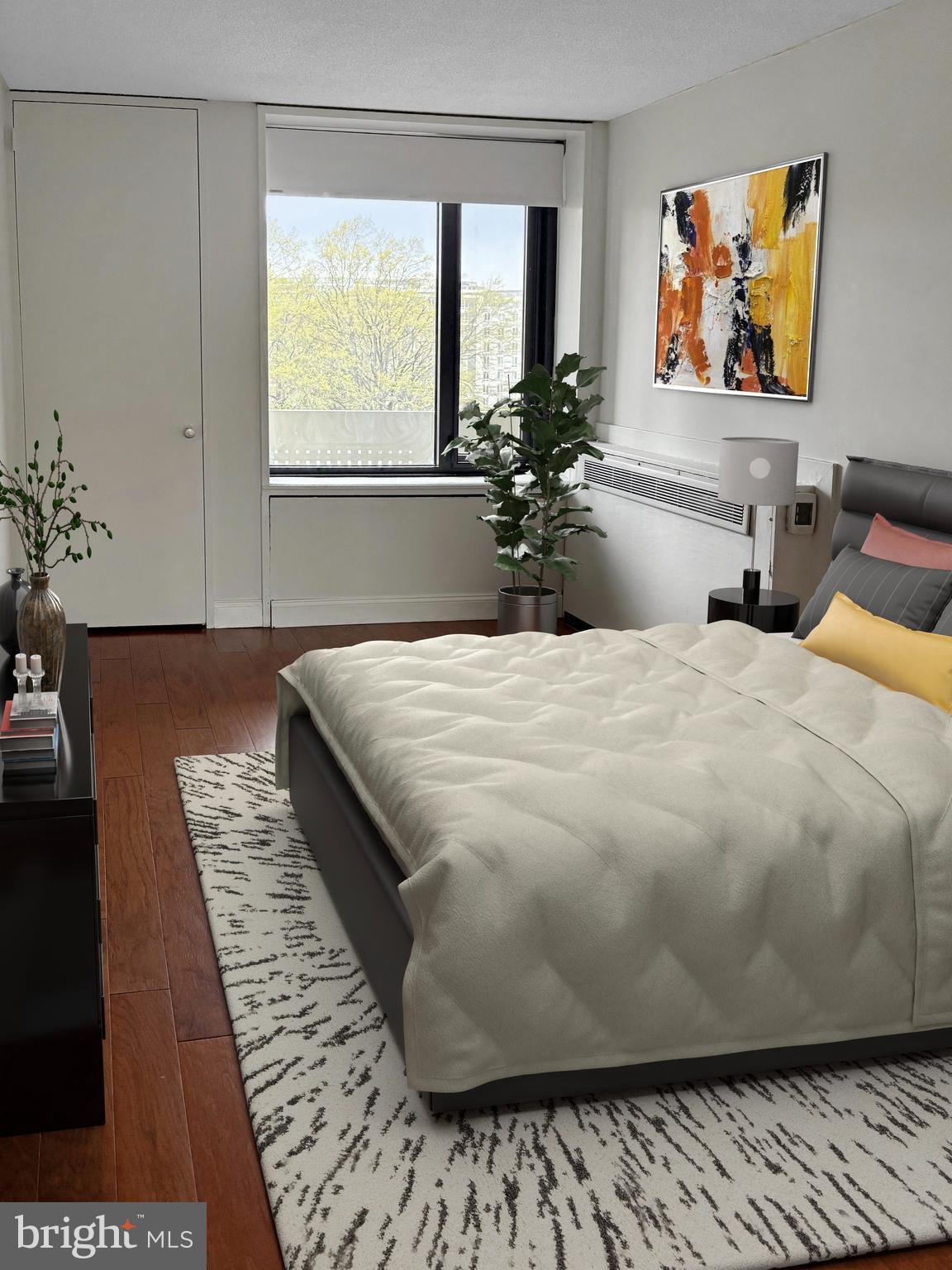 300 M Street Southwest, Unit N411 Washington, DC 20024 - Photo 5 of 13 a large bed sitting in a bedroom next to a window