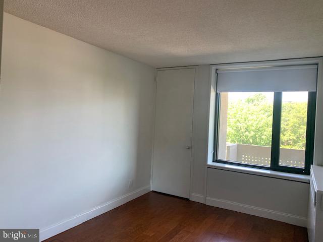300 M Street Southwest, Unit N411 Washington, DC 20024 - Photo 6 of 13 wooden floor in an empty room with a window