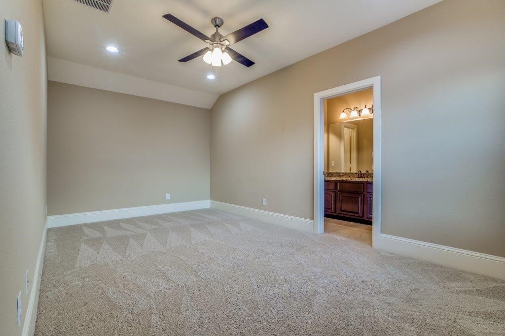 46 East Rafters Row The Woodlands, TX 77380 - Photo 20 of 25 Private third-floor suite with adjoining full bath—perfect for guests, media room, or a second home office.