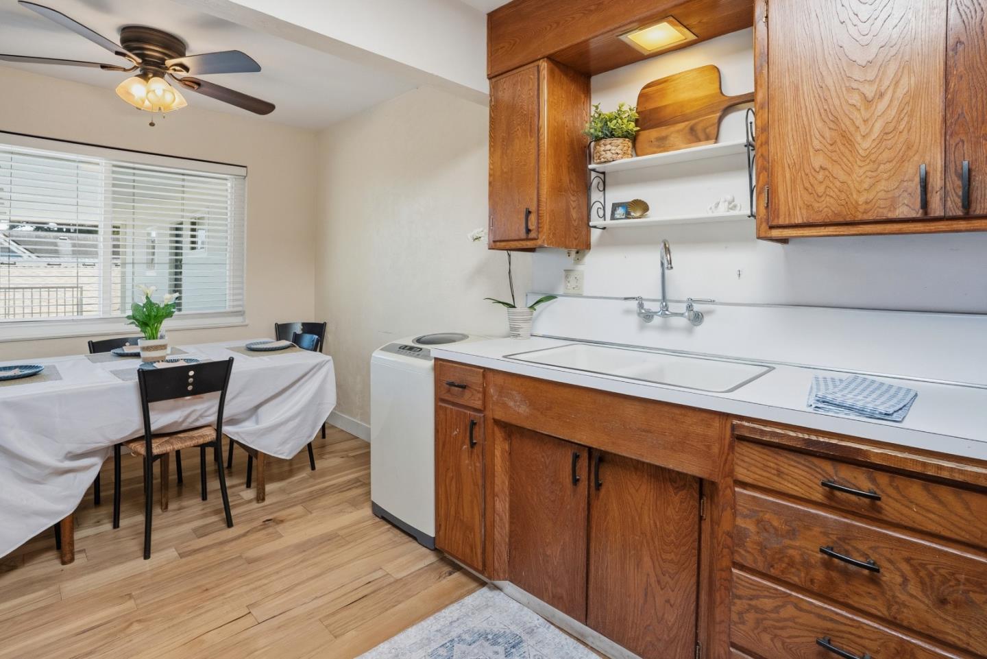 328 Main Street, Unit 13 Santa Cruz, CA 95060 - Photo 18 of 27 a view of a kitchen area with furniture and wooden floor
