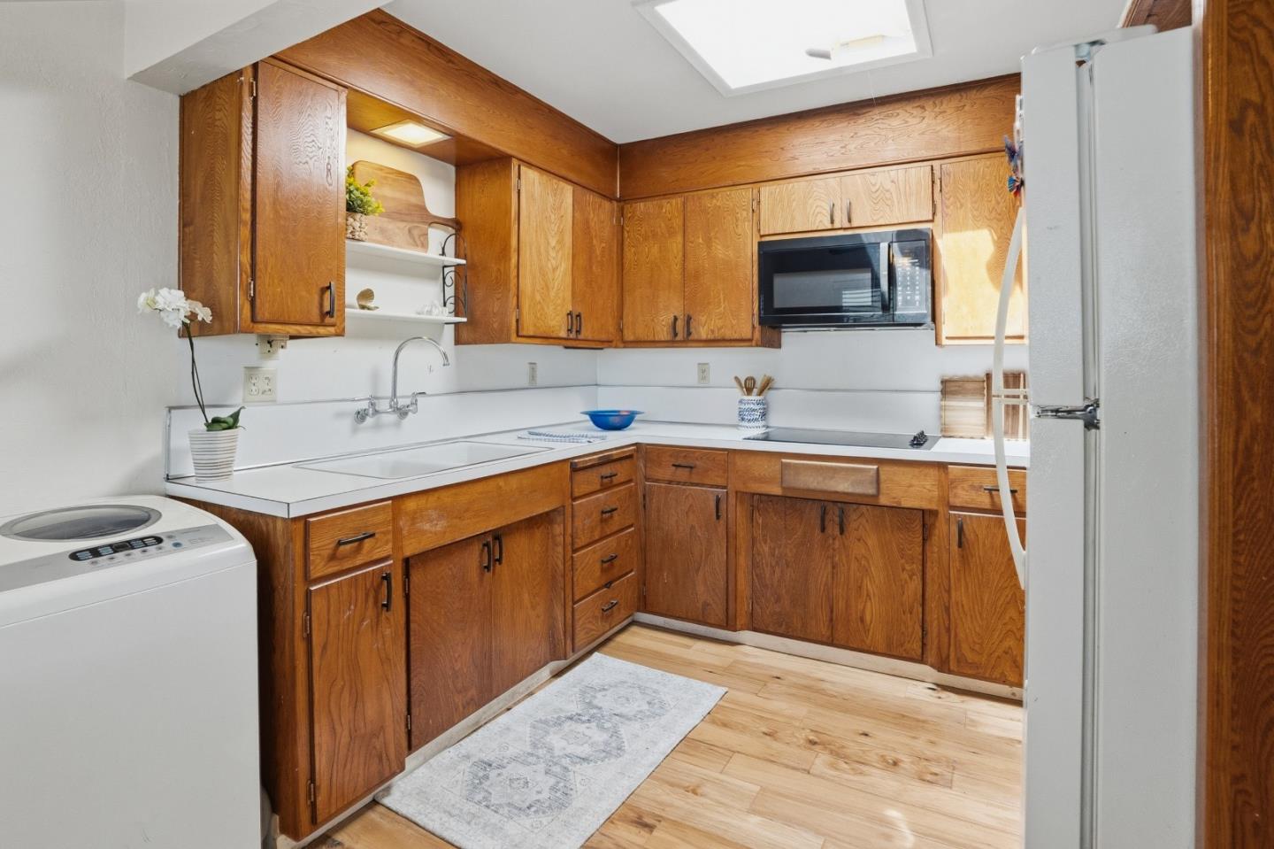 328 Main Street, Unit 13 Santa Cruz, CA 95060 - Photo 19 of 27 a kitchen with stainless steel appliances granite countertop a sink stove and cabinets