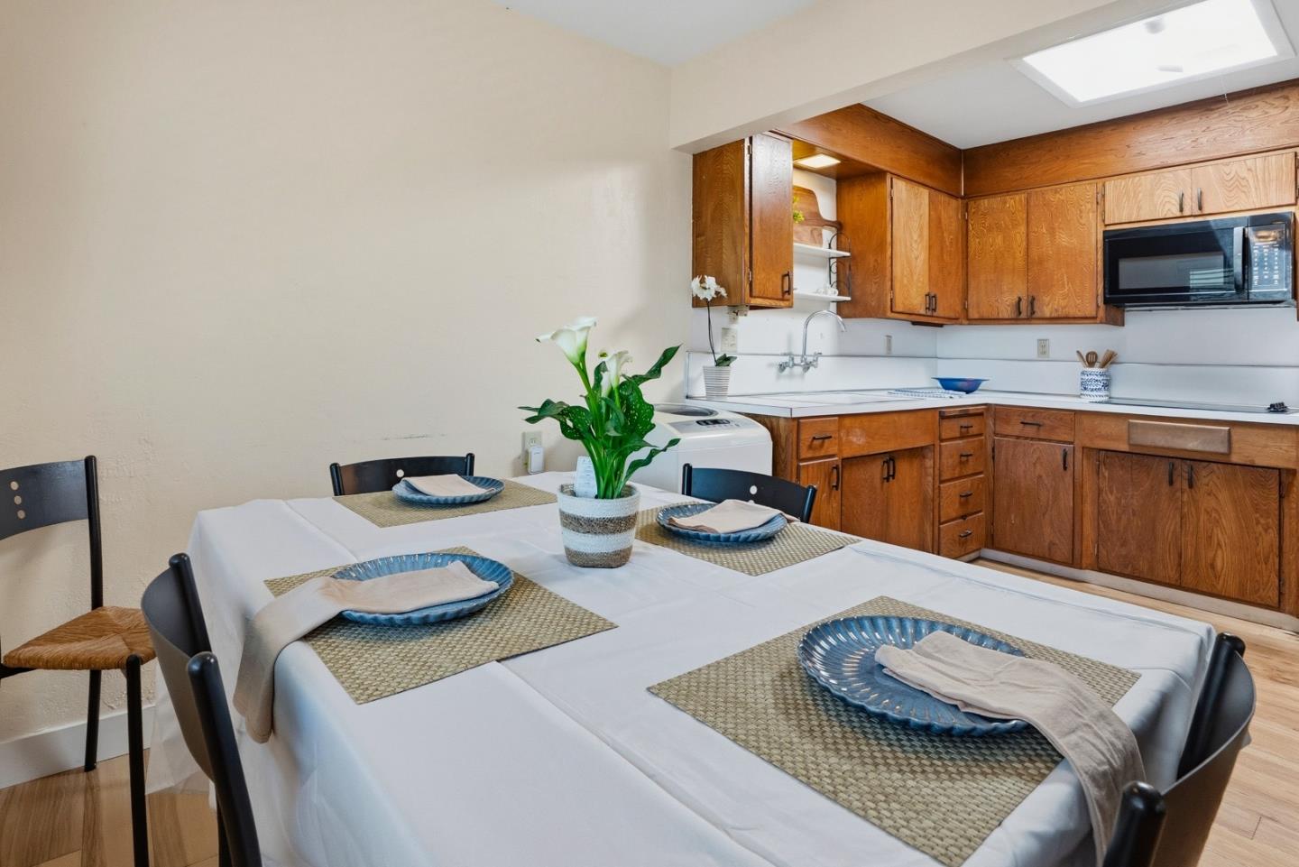 328 Main Street, Unit 13 Santa Cruz, CA 95060 - Photo 21 of 27 a kitchen with a table and chairs in it