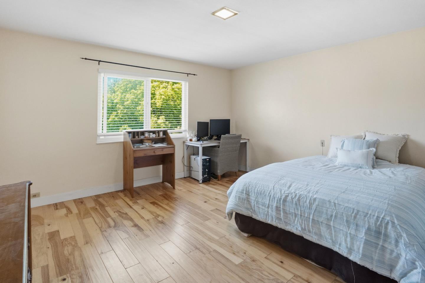 328 Main Street, Unit 13 Santa Cruz, CA 95060 - Photo 22 of 27 a bedroom with a bed and a desk
