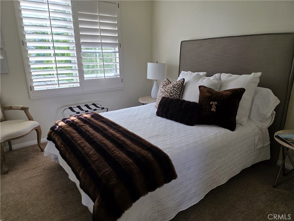 17 Avignon Newport Coast, CA 92657 - Photo 15 of 19 a bedroom with a bed and a chair