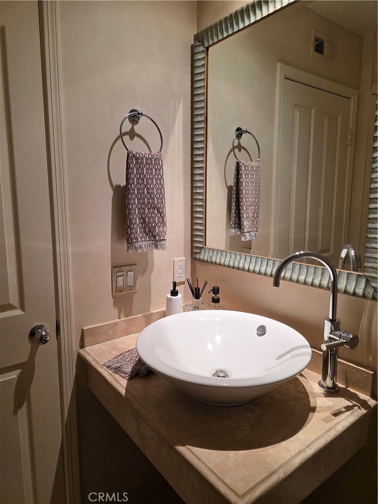 17 Avignon Newport Coast, CA 92657 - Photo 18 of 19 a bathroom with a sink and mirror