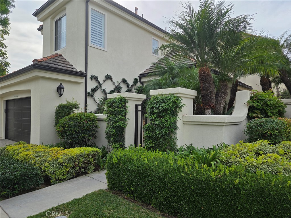 17 Avignon Newport Coast, CA 92657 - Photo 2 of 19 a front view of a house with garden