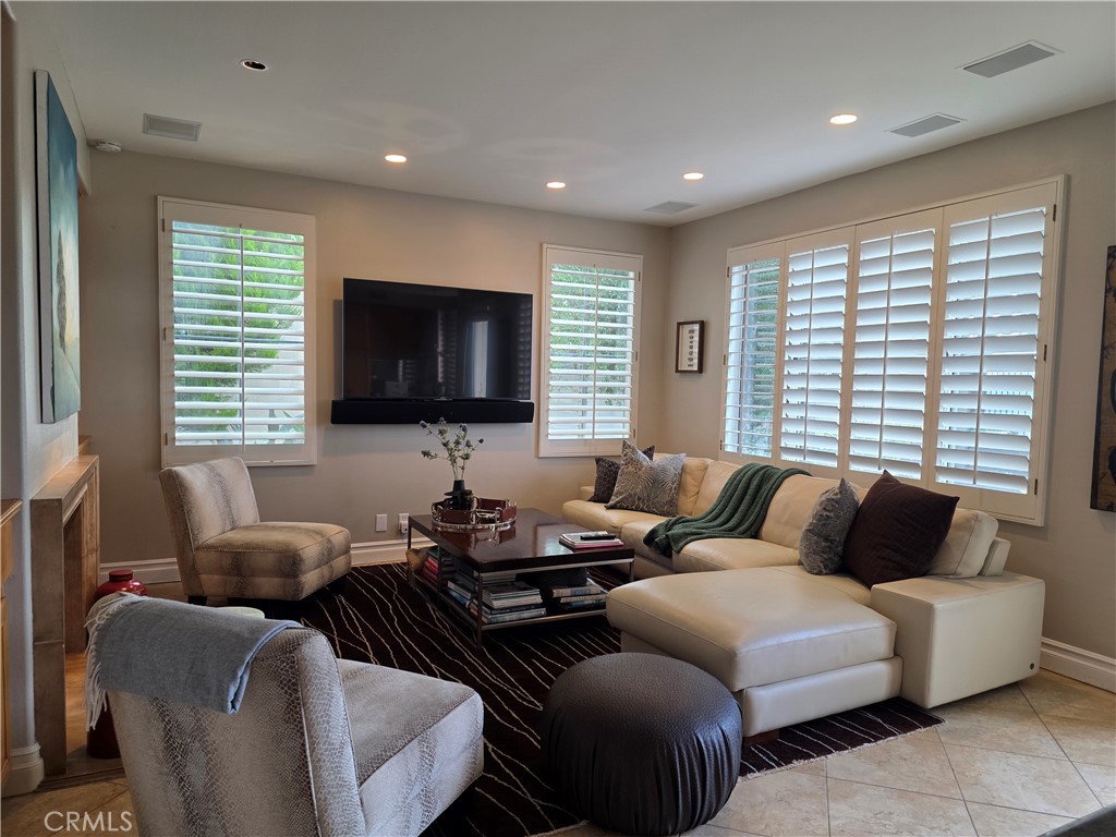 17 Avignon Newport Coast, CA 92657 - Photo 9 of 19 a living room with furniture and a flat screen tv