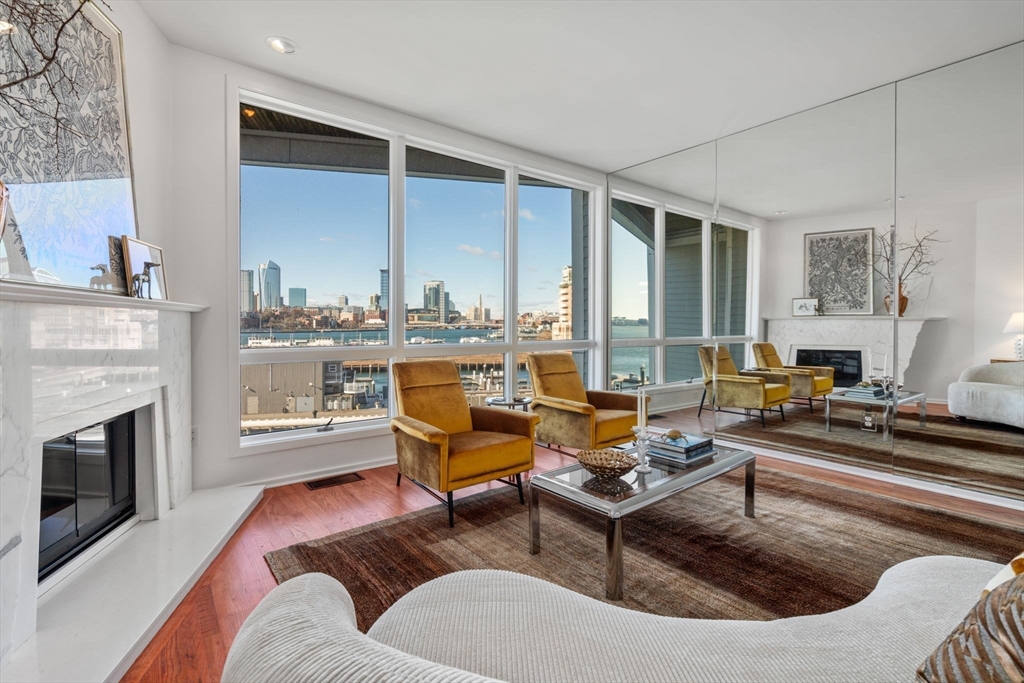 a living room with furniture fireplace and flat screen tv