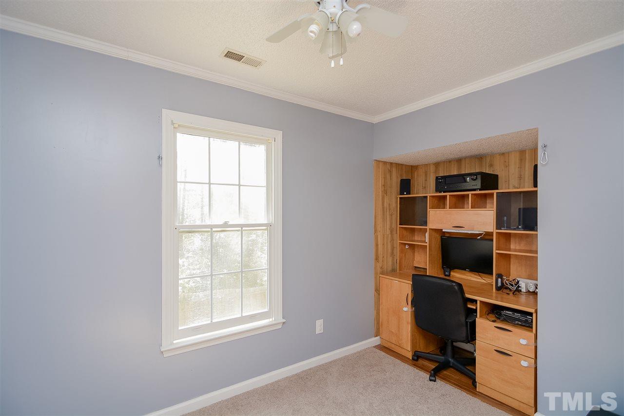 4404 Labrador Drive Raleigh, NC 27616 - Photo 13 of 25 a view of workspace with windows and cabinet
