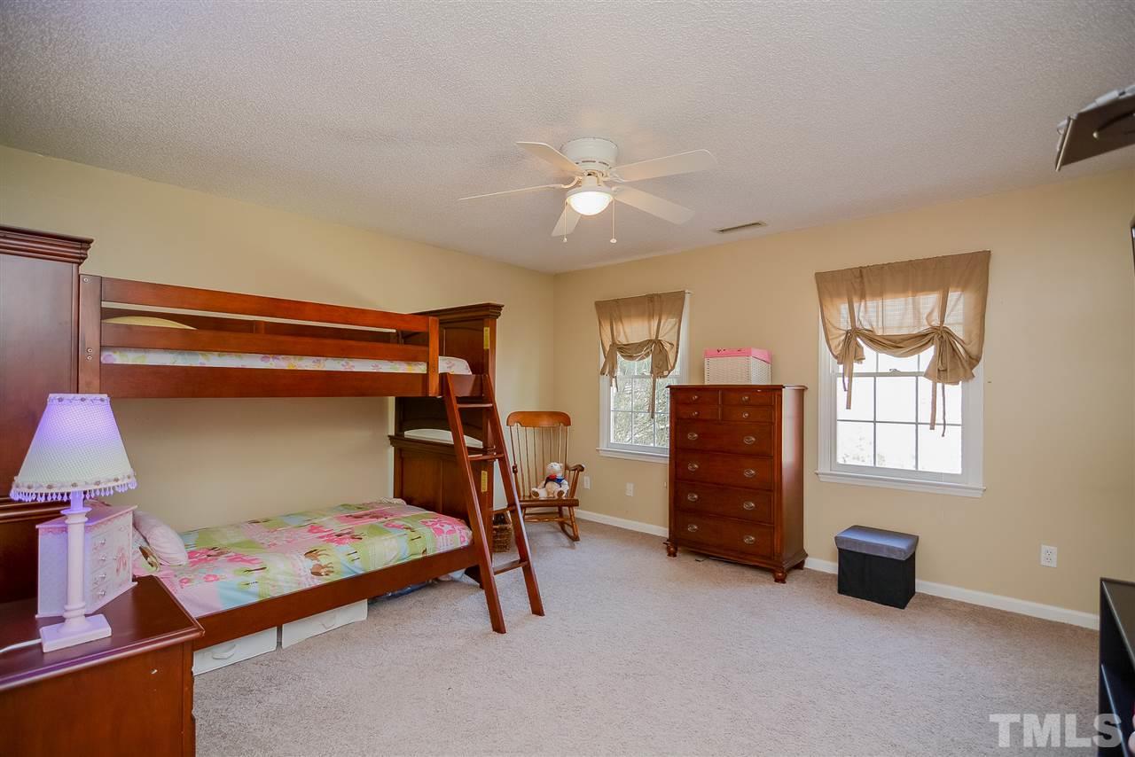 4404 Labrador Drive Raleigh, NC 27616 - Photo 14 of 25 a bedroom with furniture and a window