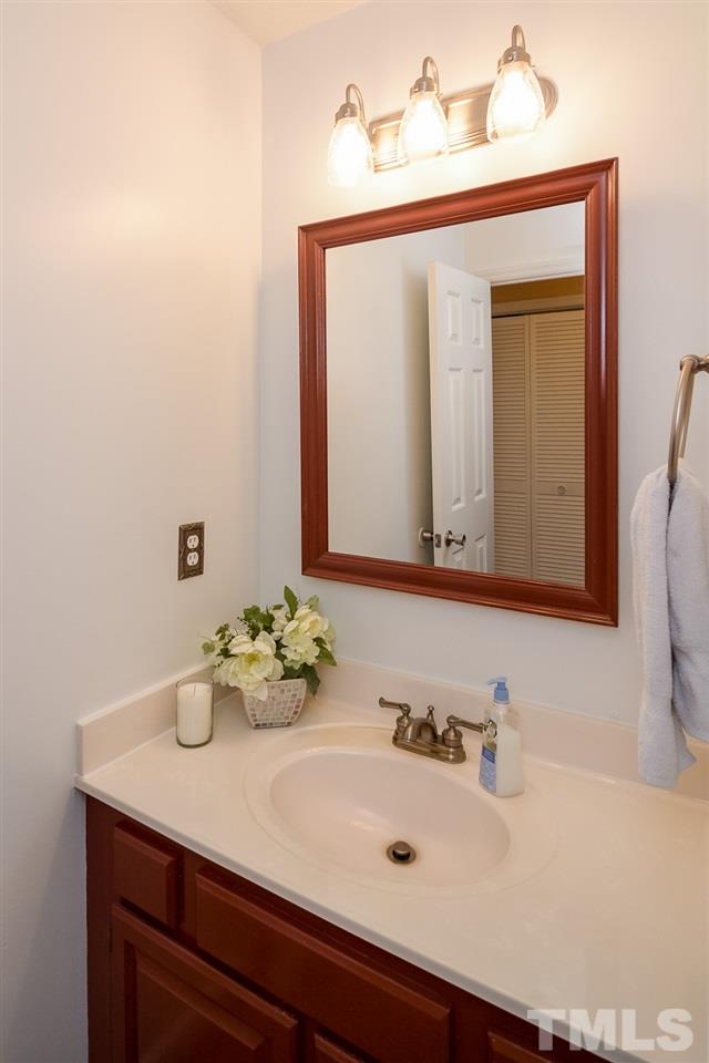 4404 Labrador Drive Raleigh, NC 27616 - Photo 16 of 25 a bathroom with a sink and a mirror